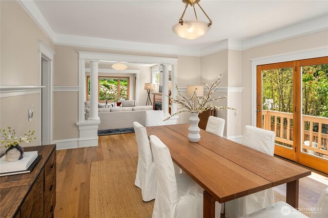 2401 10th Ave W, Seattle, WA 98119 - dining space with ornate columns and light wood-style floors