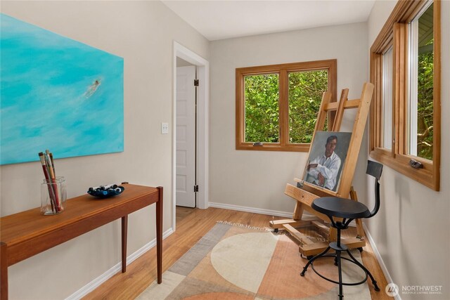 2401 10th Ave W, Seattle, WA 98119 - living area featuring wood finished floors and baseboards