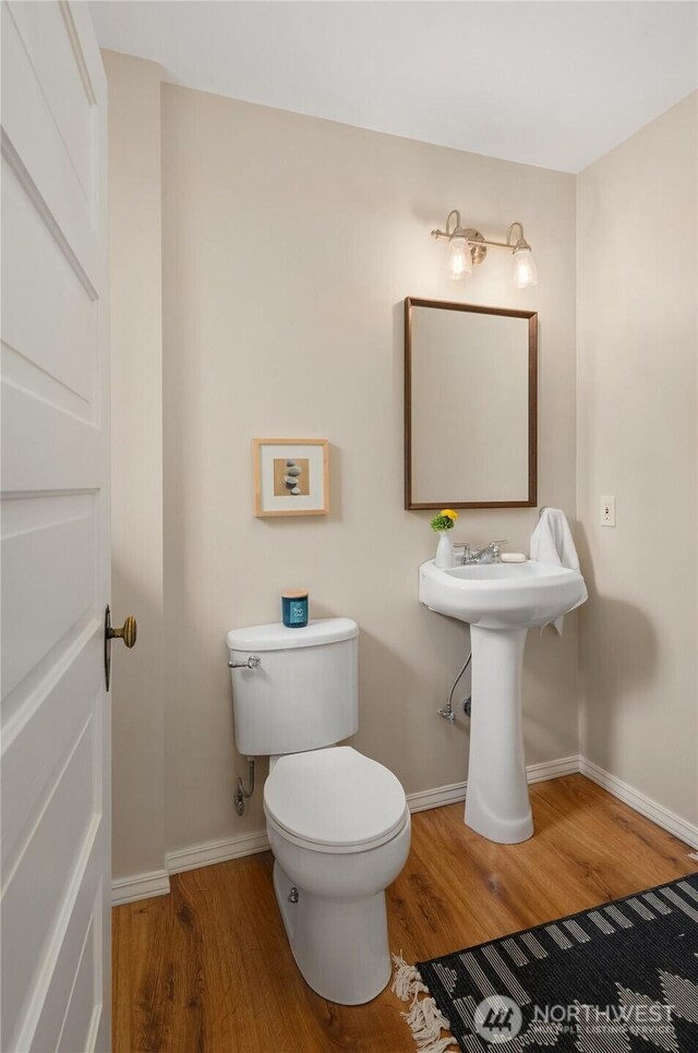2401 10th Ave W, Seattle, WA 98119 - half bathroom with wood finished floors