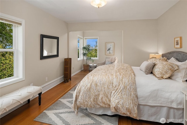 2401 10th Ave W, Seattle, WA 98119 - bedroom with multiple windows and wood finished floors