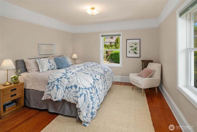 2401 10th Ave W, Seattle, WA 98119 - bedroom with wood finished floors and multiple windows