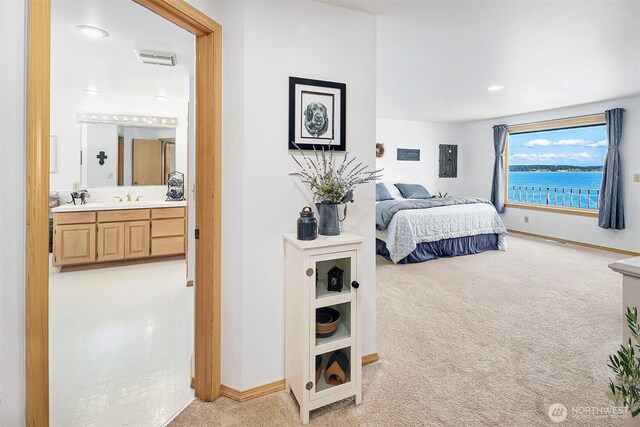 212 Tala Shore Dr, Port Ludlow, WA 98365 - bedroom with light carpet, connected bathroom, and recessed lighting