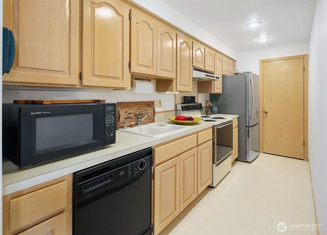 212 Tala Shore Dr, Port Ludlow, WA 98365 - kitchen featuring black appliances, light brown cabinets, and light countertops