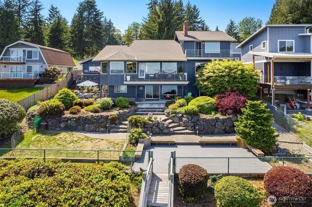 212 Tala Shore Dr, Port Ludlow, WA 98365 - back of property with a balcony and a fenced backyard
