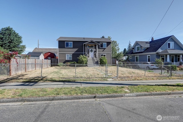 1011 S 64th St, Tacoma, WA 98408 - split foyer home featuring a fenced front yard