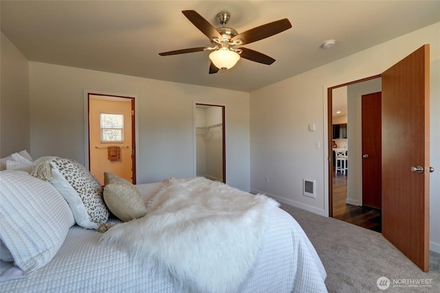 1011 S 64th St, Tacoma, WA 98408 - bedroom with dark carpet, ceiling fan, and a closet