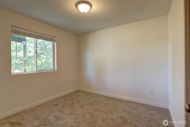 1011 S 64th St, Tacoma, WA 98408 - carpeted spare room featuring baseboards