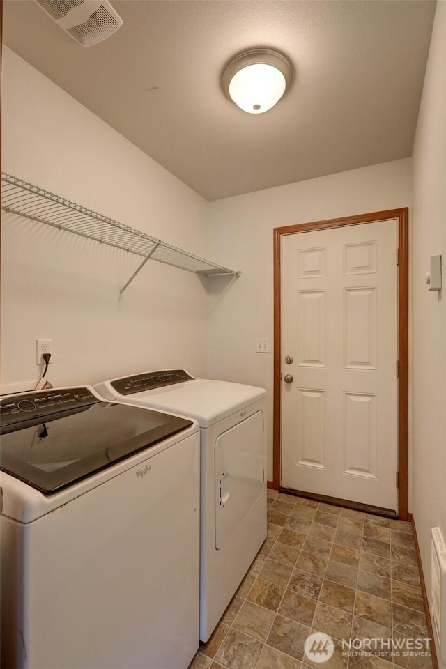1011 S 64th St, Tacoma, WA 98408 - laundry area featuring separate washer and dryer and stone finish floors