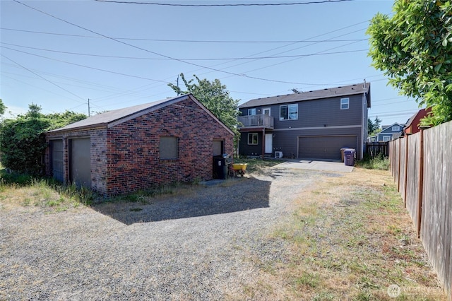 1011 S 64th St, Tacoma, WA 98408 - rear view of house featuring brick siding and dirt driveway