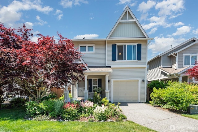1228 81st Dr SE, Lake Stevens, WA 98258 - view of front of property with board and batten siding, an attached garage, and concrete driveway