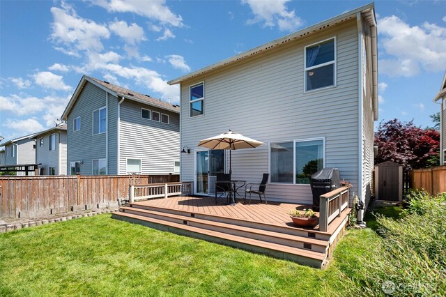 1228 81st Dr SE, Lake Stevens, WA 98258 - back of property with a storage unit and a wooden deck