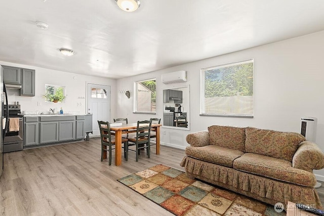 4515 14th Way SE, Lacey, WA 98503 - living room with a wall mounted AC and light wood-style flooring