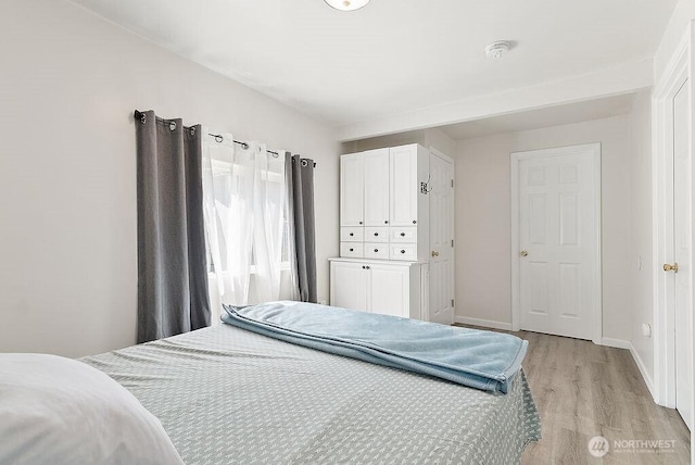4515 14th Way SE, Lacey, WA 98503 - bedroom with light wood-style flooring and baseboards