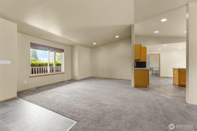1875 Florence St, Enumclaw, WA 98022 - unfurnished living room with light colored carpet, recessed lighting, and vaulted ceiling