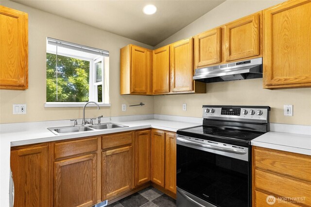 1875 Florence St, Enumclaw, WA 98022 - kitchen with stainless steel electric range, under cabinet range hood, lofted ceiling, light countertops, and recessed lighting