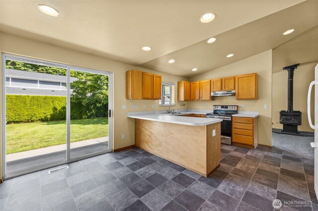 1875 Florence St, Enumclaw, WA 98022 - kitchen featuring electric range, under cabinet range hood, a wood stove, a peninsula, and recessed lighting