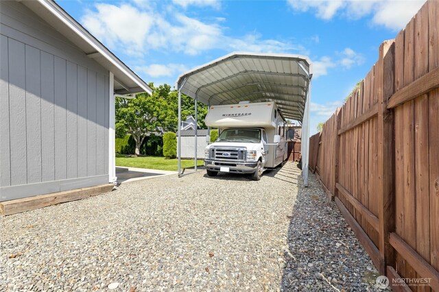 1875 Florence St, Enumclaw, WA 98022 - view of parking featuring a detached carport and a fenced backyard