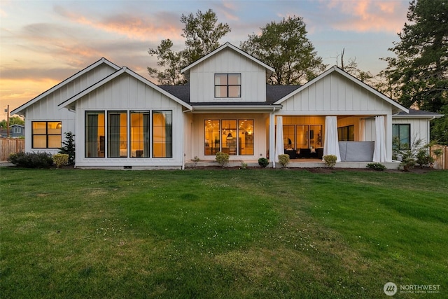 1521 8th St SW, Puyallup, WA 98371 - back of house at dusk featuring board and batten siding and roof with shingles