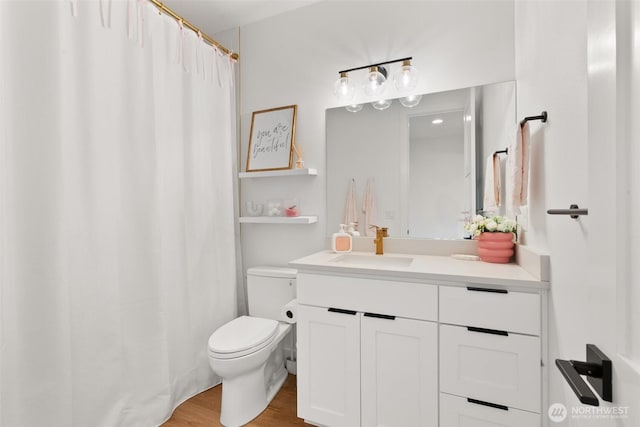 1521 8th St SW, Puyallup, WA 98371 - full bathroom with vanity, wood finished floors, and a shower with curtain