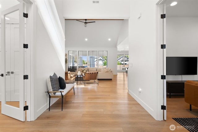 1521 8th St SW, Puyallup, WA 98371 - hallway with light wood finished floors, recessed lighting, and a towering ceiling