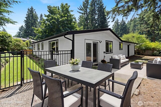 5206 68th Ave W, University Place, WA 98467 - back of property with an outdoor living space, outdoor dining area, and a patio