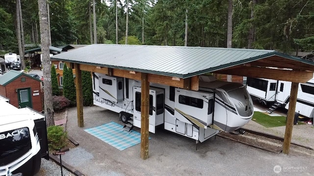 1546 Reservation Rd SE Unit 222, Olympia, WA 98513 - exterior space with a metal roof, a view of trees, and a carport