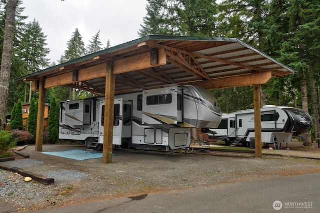 1546 Reservation Rd SE Unit 222, Olympia, WA 98513 - view of parking / parking lot featuring a carport