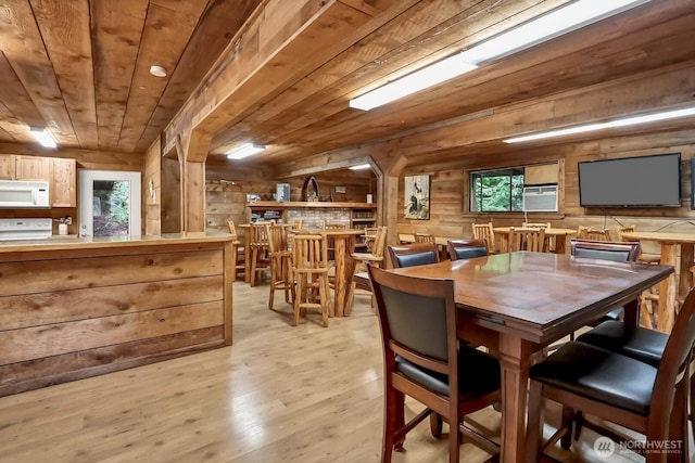 1546 Reservation Rd SE Unit 222, Olympia, WA 98513 - dining room with wooden ceiling, wood walls, and light wood-style flooring