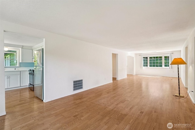 11112 E Riverside Dr, Bothell, WA 98011 - unfurnished living room featuring light wood-style floors