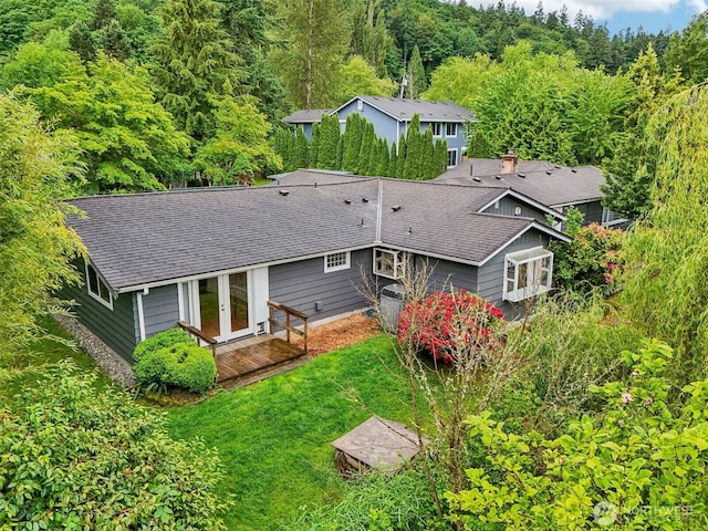 11112 E Riverside Dr, Bothell, WA 98011 - rear view of property featuring french doors, roof with shingles, a forest view, and a yard