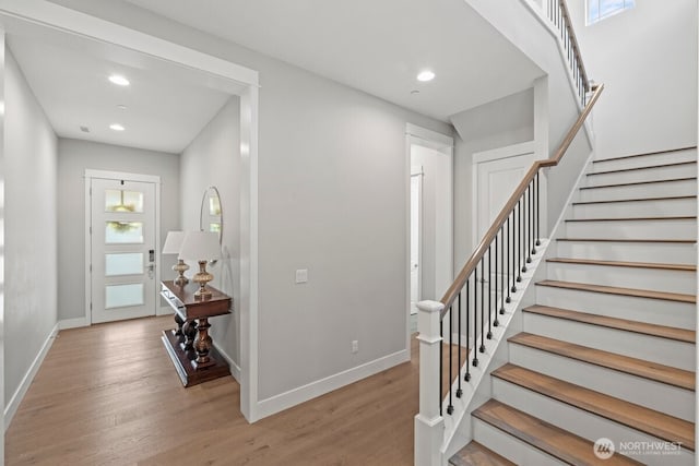 3348 218th St SE, Bothell, WA 98021 - entryway with light wood finished floors, stairway, and recessed lighting