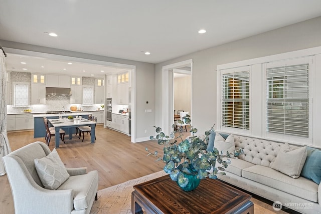 3348 218th St SE, Bothell, WA 98021 - living room featuring light wood-style floors and recessed lighting