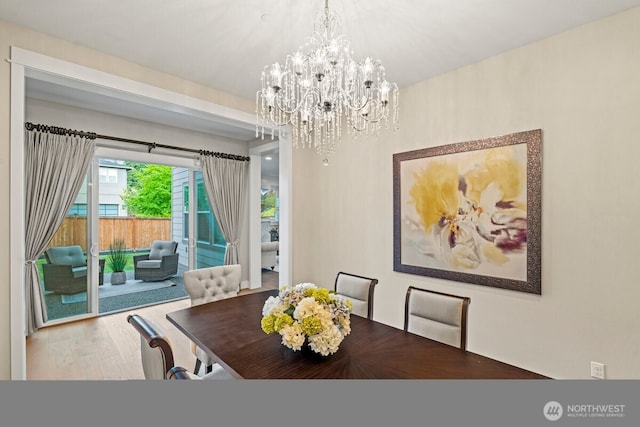 3348 218th St SE, Bothell, WA 98021 - dining area with a chandelier and wood finished floors