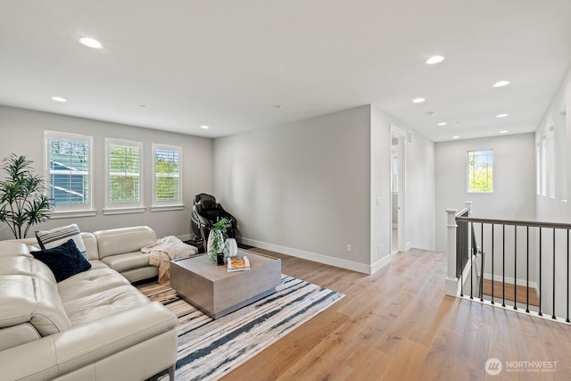 3348 218th St SE, Bothell, WA 98021 - living area with light wood-style floors and recessed lighting