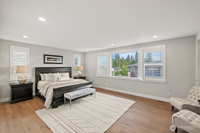 3348 218th St SE, Bothell, WA 98021 - bedroom with wood finished floors and recessed lighting