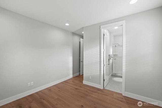 3348 218th St SE, Bothell, WA 98021 - unfurnished bedroom featuring wood finished floors and recessed lighting