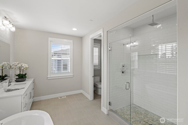 3348 218th St SE, Bothell, WA 98021 - bathroom featuring a shower stall, vanity, recessed lighting, and a freestanding bath