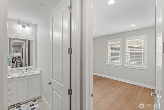 3348 218th St SE, Bothell, WA 98021 - bathroom featuring vanity, wood finished floors, and recessed lighting