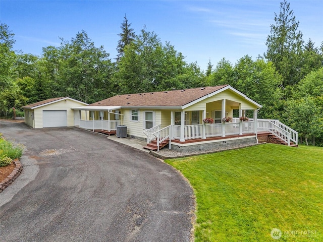 158 S Fork Rd, Raymond, WA 98577 - ranch-style house featuring covered porch, a garage, an outdoor structure, crawl space, and a front lawn