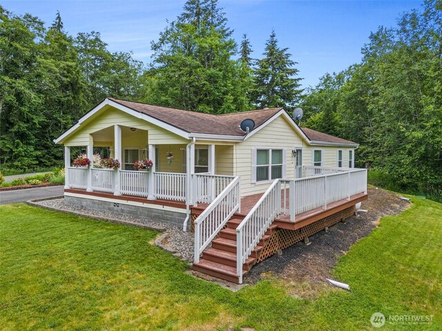 158 S Fork Rd, Raymond, WA 98577 - single story home featuring a porch, a front yard, and a shingled roof