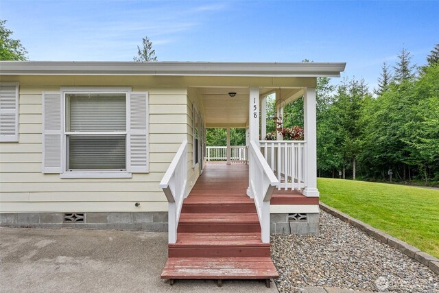 158 S Fork Rd, Raymond, WA 98577 - entrance to property featuring crawl space, a lawn, and covered porch