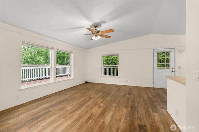 158 S Fork Rd, Raymond, WA 98577 - spare room with lofted ceiling, wood finished floors, and a ceiling fan
