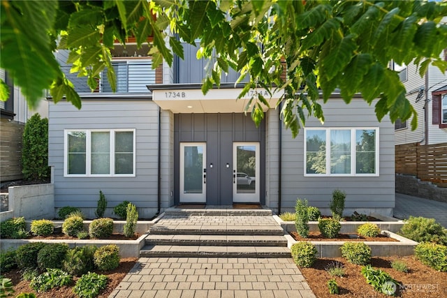 1734 NW 62nd St Unit A, Seattle, WA 98107 - property entrance featuring french doors and board and batten siding