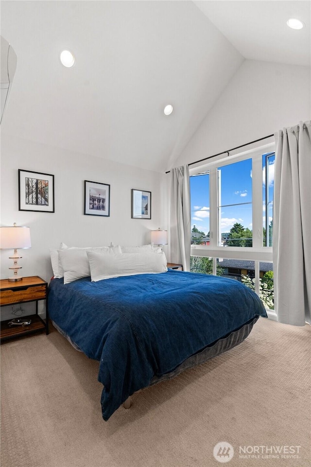1734 NW 62nd St Unit A, Seattle, WA 98107 - bedroom with vaulted ceiling, carpet flooring, and recessed lighting