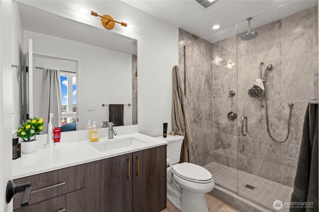 1734 NW 62nd St Unit A, Seattle, WA 98107 - ensuite bathroom with vanity, a shower stall, tile patterned floors, and recessed lighting