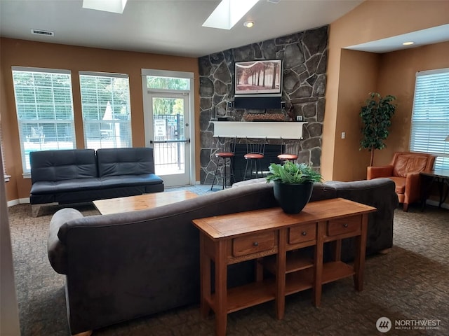 25025 SE Klahanie Blvd Unit D202, Sammamish, WA 98029 - carpeted living room with a skylight and vaulted ceiling