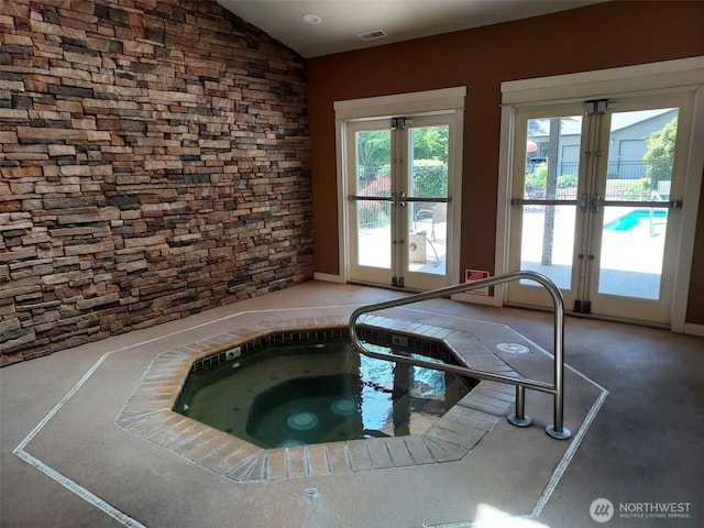 25025 SE Klahanie Blvd Unit D202, Sammamish, WA 98029 - view of swimming pool with french doors and an in-ground hot tub