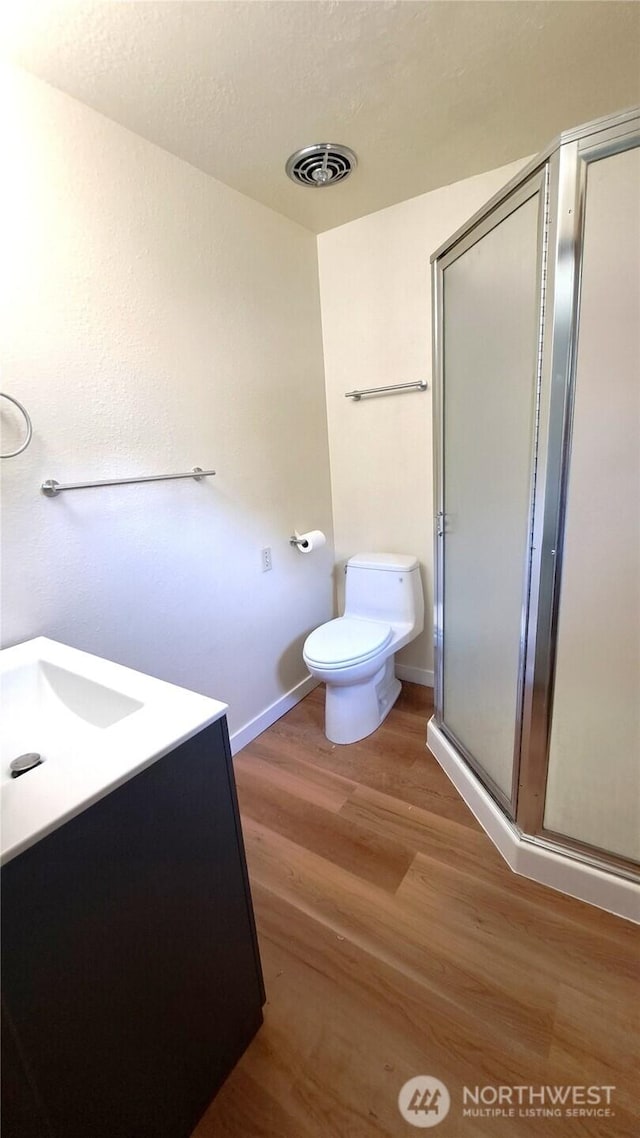 3410 Forest Ct, Bellingham, WA 98225 - full bath featuring wood finished floors, a stall shower, and vanity