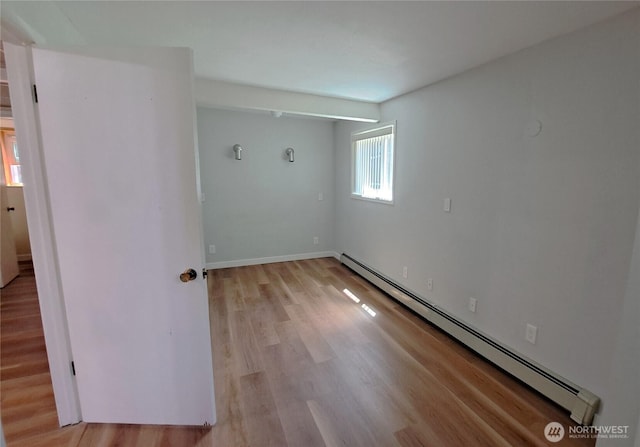 3410 Forest Ct, Bellingham, WA 98225 - empty room with a baseboard heating unit and light wood finished floors