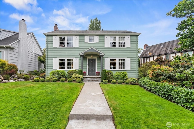 4116 N 39th St, Tacoma, WA 98407 - colonial house featuring a front lawn and a chimney